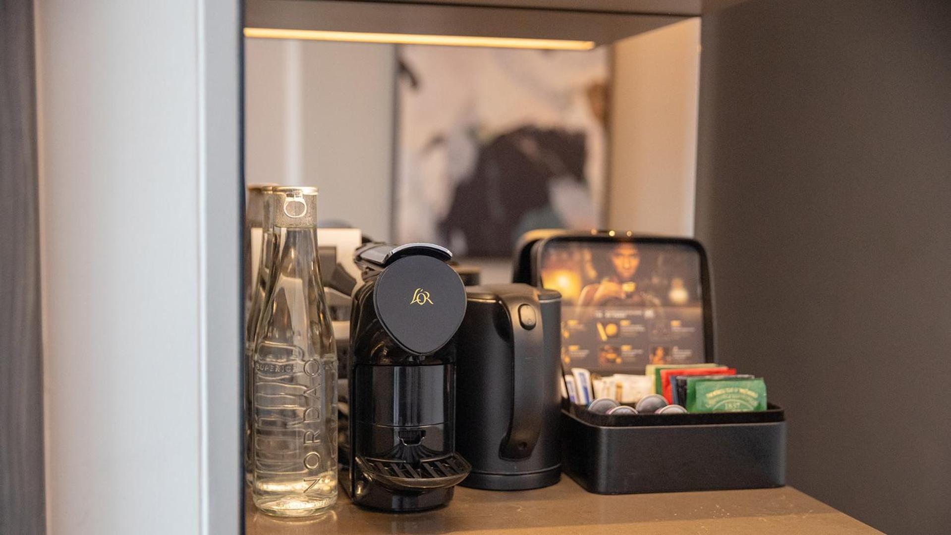Chatrium Grand Bangkok Luaran gambar A Nespresso coffee machine in a hotel room